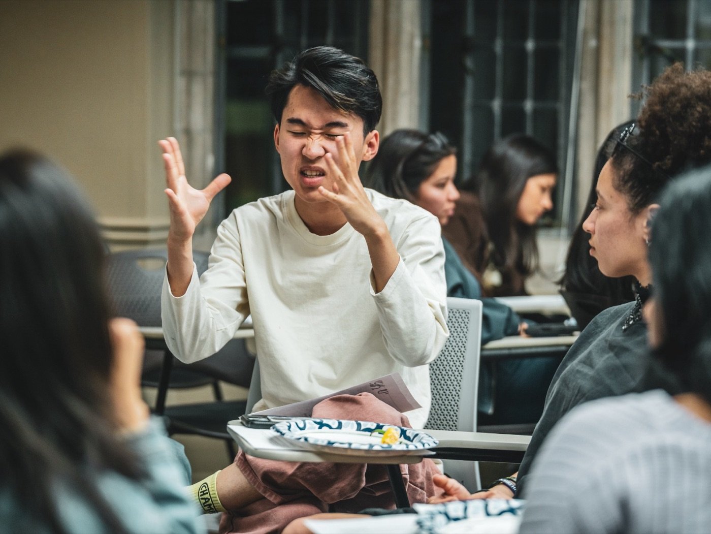 A student animatedly telling a story